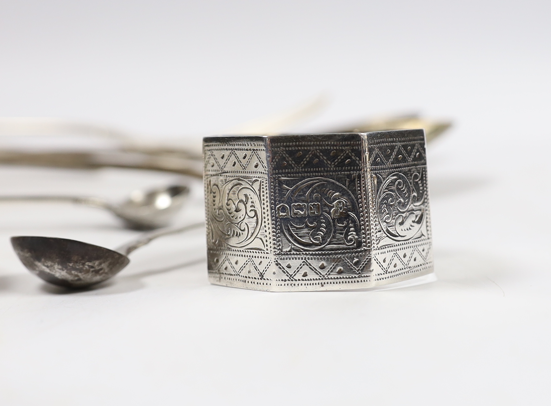 Eleven assorted items of mainly 19th century silver flatware and a silver napkin ring, 18oz.